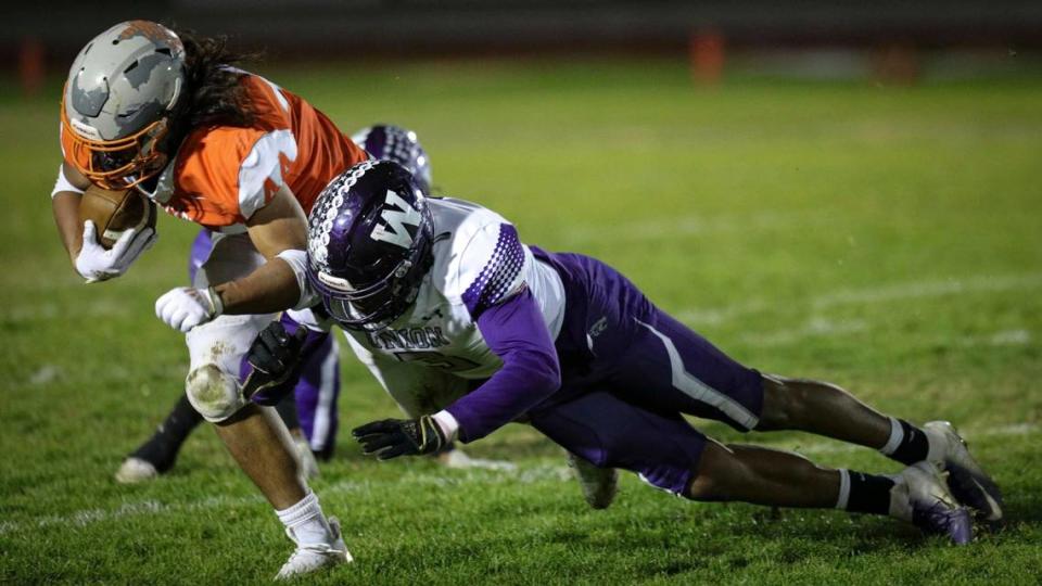 Mateo Cano is hit by Ryan Brown. Atascadero’s winning streak dating back to last season ended against Washington Union with the Greyhounds falling to the Panthers 41-13 Nov. 9, 2023.