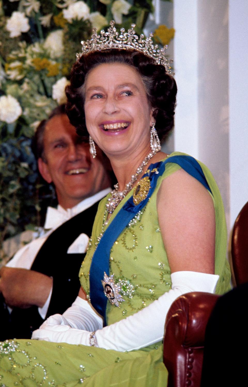 The Queen laughs while attending a Government reception at Parliament House, Canberra (Ben Roll/PA) (PA Archive)