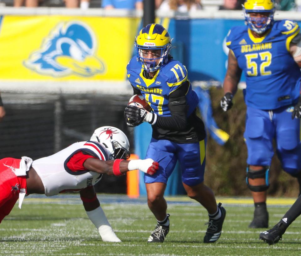 Delaware receiver Jourdan Townsend (17) gets past Richmond defensive back Bryson Parker in the first quarter of Richmond's 21-13 win at Delaware Stadium, Saturday, Nov. 12, 2022.