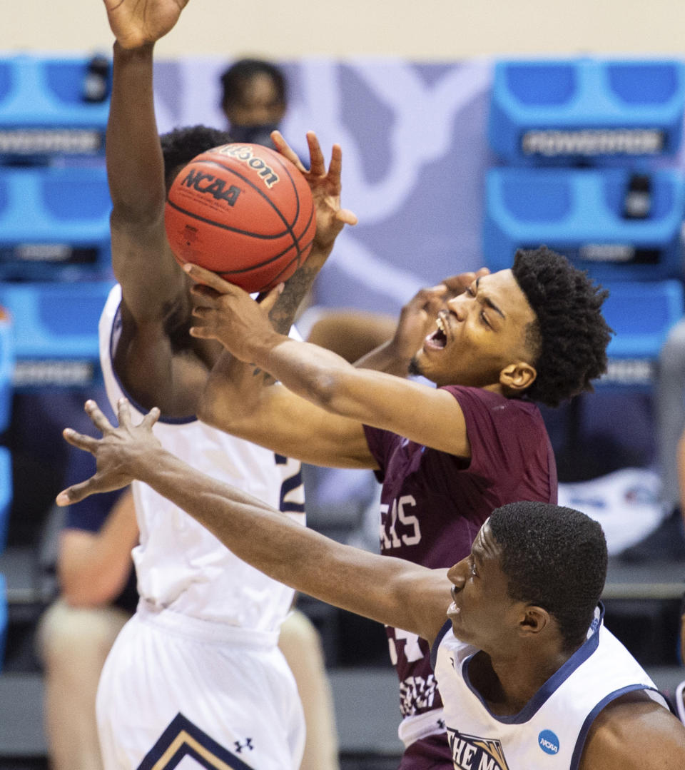 Texas Southern forward John Walker III (24) is fouled as he takes a shot during the first half of a First Four game against Mount St. Mary's in the NCAA men's college basketball tournament, Thursday, March 18, 2021, in Bloomington, Ind. (AP Photo/Doug McSchooler)