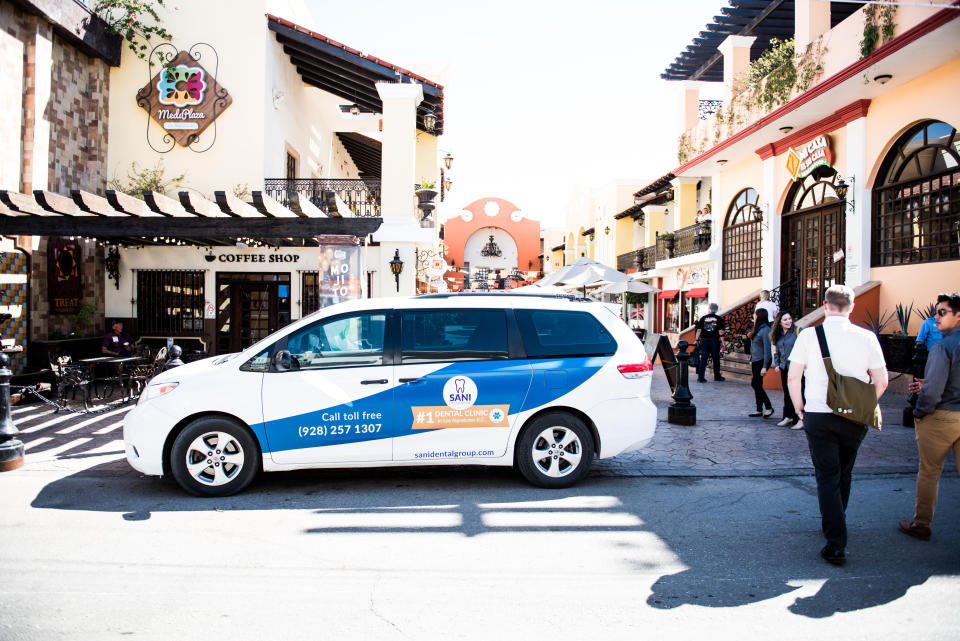 The Sani Dental Group's shuttle was a common sight throughout Los Algadones, aka "Molar City." Here, it is parked outside a busy medical plaza in 2019. (Photo: Ash Ponders for HuffPost)