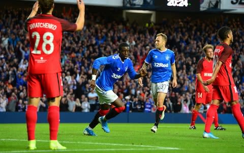 Sheyi Ojo of Rangers celebrates scoring a goal in the first half during the UEFA Europa League Third Qualifying Round Second Leg match between Rangers and Midtjylland at Ibrox Stadium - Credit: GETTY IMAGES