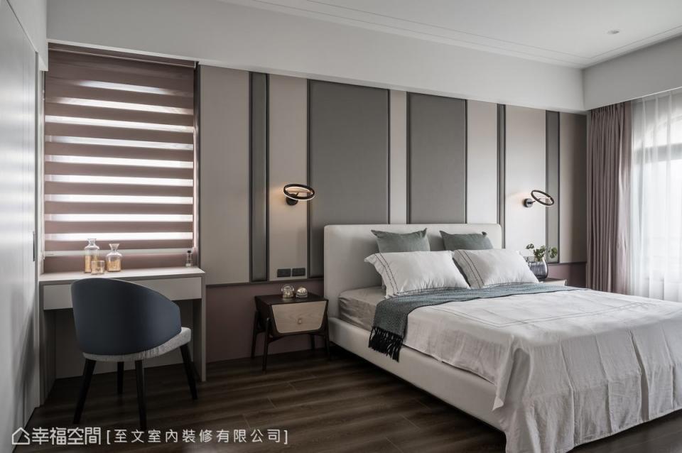 床頭以寬度不同的灰色繃板譜寫生動的空間韻致，形塑活潑與沉靜並存的對比張力。