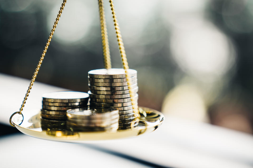 Stack of coins on a weighing scale