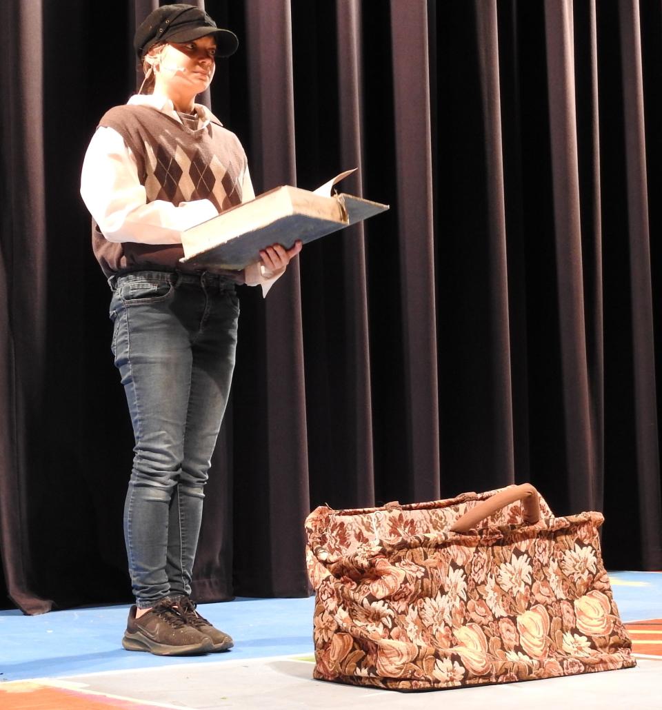 Junior Alahna Thompson plays James in "James and the Giant Peach: The Musical" at Coshocton High School. She's seen here with a potion book that allows her to grow a peach to a giant size.