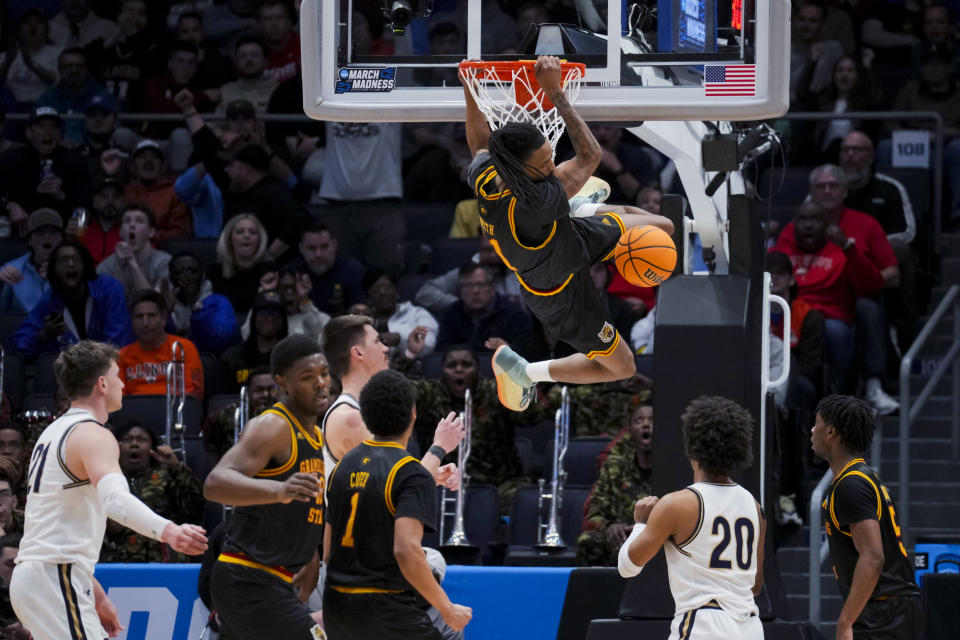 Grambling State guard Jourdan Smith (11) dunks against Montana State during overtime of a First Four game in the NCAA men's college basketball tournament Wednesday, March 20, 2024, in Dayton, Ohio. (AP Photo/Aaron Doster)