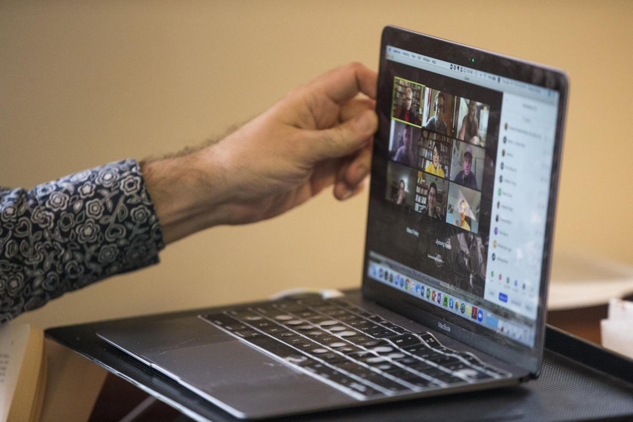 Chance Bonar, a PhD candidate at Harvard, tilts his screen while teaching an online class from his dorm on April 16, 2020 in Cambridge, MA. (Photo by Blake Nissen for The Boston Globe via Getty Images)