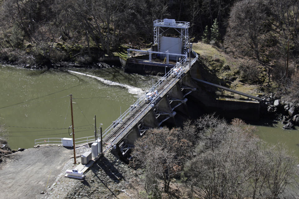 FILE - A dam on the lower Klamath River known as Copco 2 is seen near Hornbrook, Calif., on March 3, 2020. Plans for the largest dam demolition project in U.S. history to save imperiled salmon could soon become reality, with the first stages of construction starting in California as early as this summer. The Federal Energy Regulatory Commission meets Thursday, Nov. 17, 2022, and is expected to vote on whether to approve the surrender of PacificCorp's hydroelectric license for four dams on the lower Klamath River in remote northern California. (AP Photo/Gillian Flaccus, File)