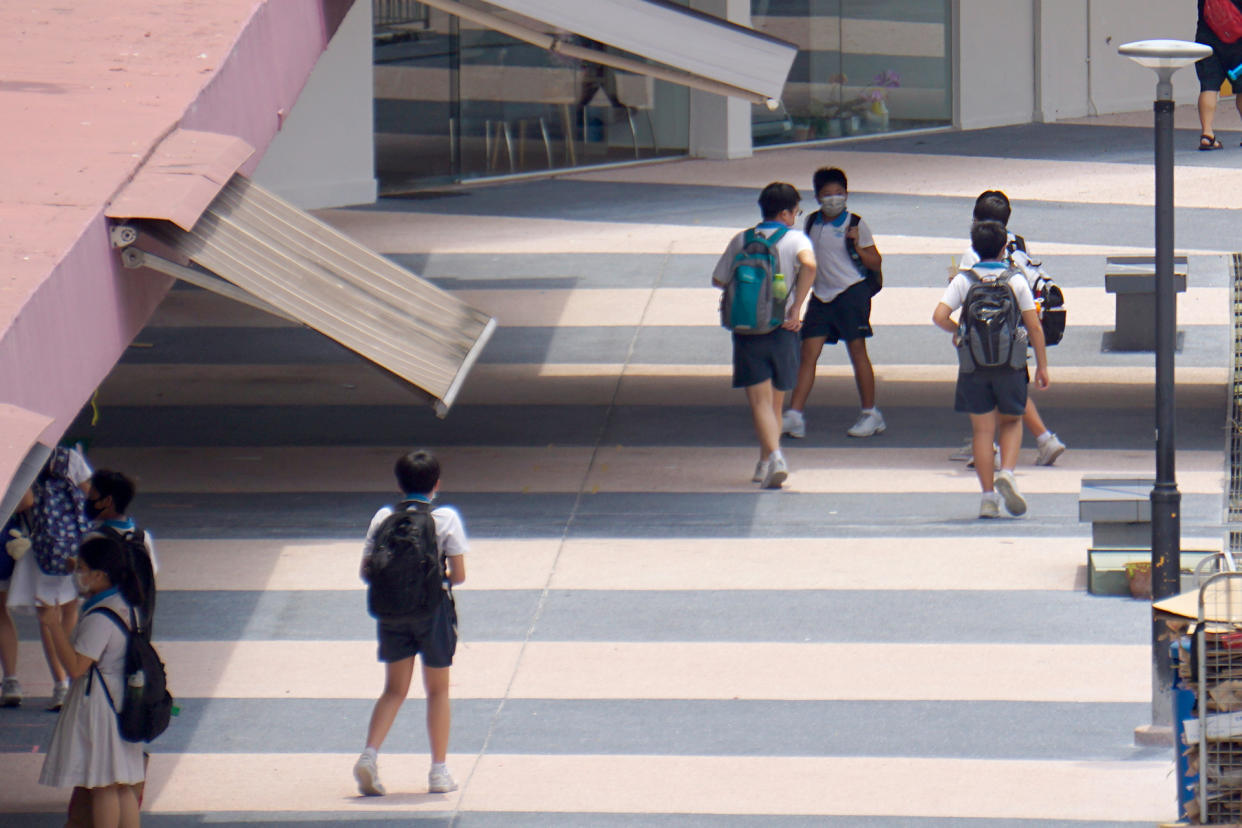 Schoolchildren in face masks seen in the Queen’s Road area. (PHOTO: Dhany Osman / Yahoo News Singapore)