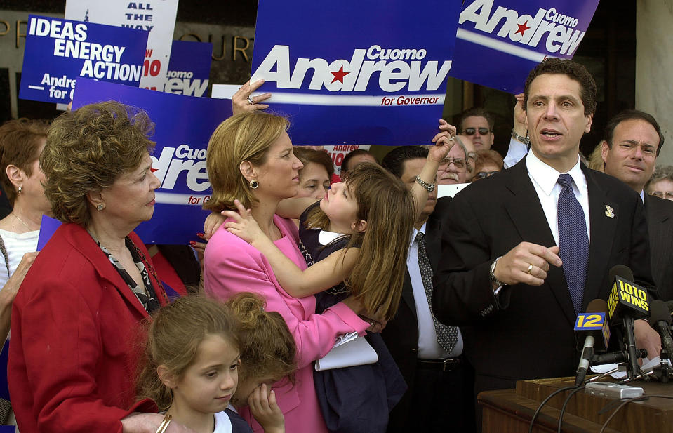 FILE — In this April 16, 2002 file photo, Andrew Cuomo, right, announces his intention to run for governor of New York, as his mother, Matilda, left, his daughters, in foreground, Mariah, 7, left, Cara, 7, second left, his wife, Kerry Kennedy Cuomo, and daughter Michaela, 4, center, stand at his side in Mineola, N.Y. New York’s attorney general has promised a thorough investigation of allegations that Cuomo sexually harassed at least two women. (AP Photo/Ed Betz, File)