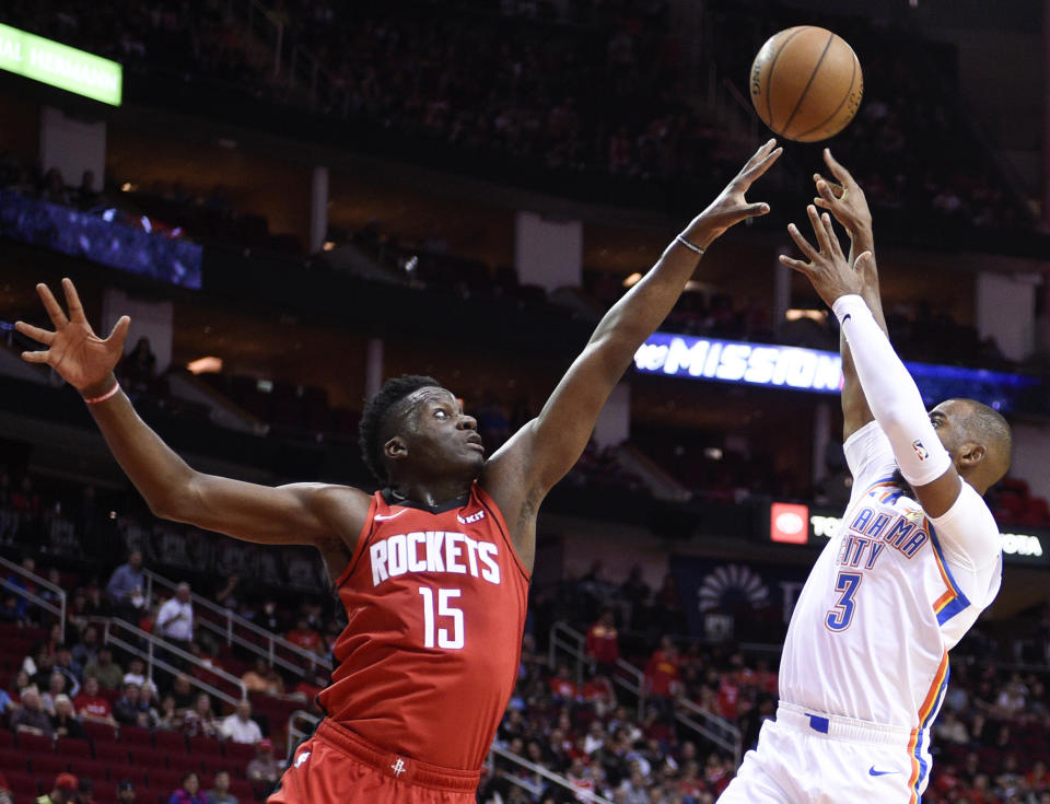 Oklahoma City Thunder guard Chris Paul (3) shoots as Houston Rockets center Clint Capela defends during the first half of an NBA basketball game, Monday, Oct. 28, 2019, in Houston. (AP Photo/Eric Christian Smith)