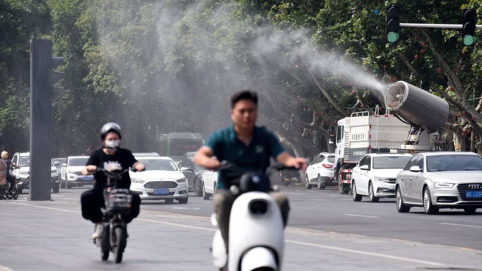 A fog cannon truck sprays water to cool citizens on Zhonghua Street in Handan, North China's Hebei province, July 6, 2023.  - CFOTO/Future Publishing/Getty Images