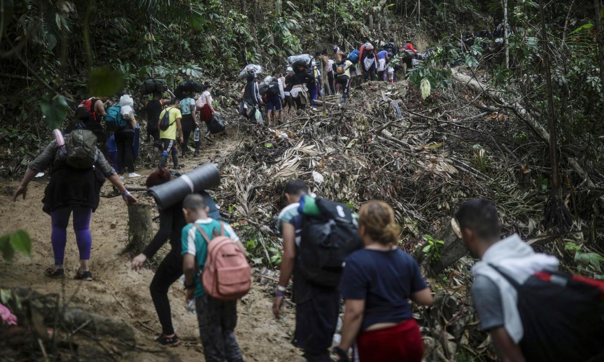 <span>The journey across the Darien Gap is long and difficult, as seen here on 9 May 2023.</span><span>Photograph: Iván Valencia/AP</span>