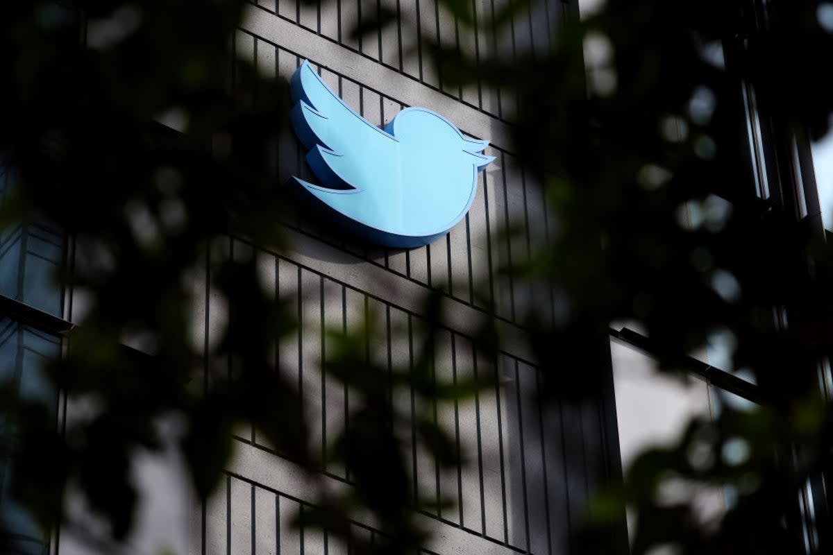 The Twitter logo is posted on the exterior of Twitter headquarters on 28 October, 2022 in San Francisco, California (Getty Images)