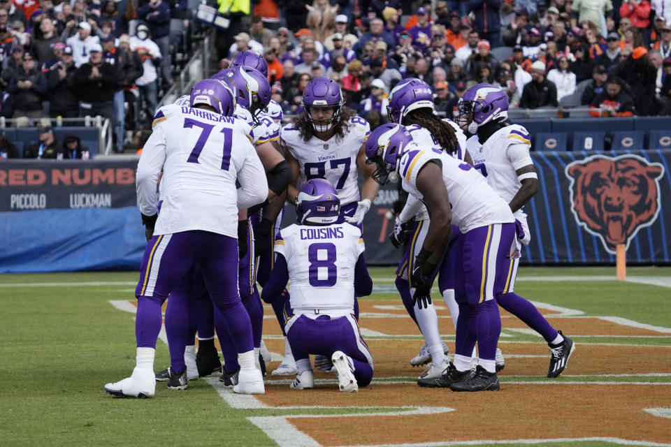 Minnesota Vikings quarterback Kirk Cousins (8) talks to his team during the second half of an NFL football game against the Chicago Bears, Sunday, Oct. 15, 2023, in Chicago. (AP Photo/Nam Y. Huh)