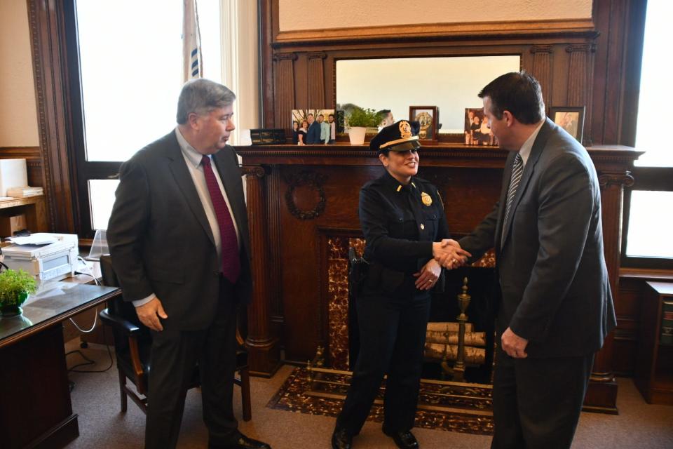 Acting Brockton Police Chief Brenda Perez, left, shakes hands with Mayor Robert Sullivan after her swearing in at the City Clerk's office in City Hall on Monday, April 4, 2022.