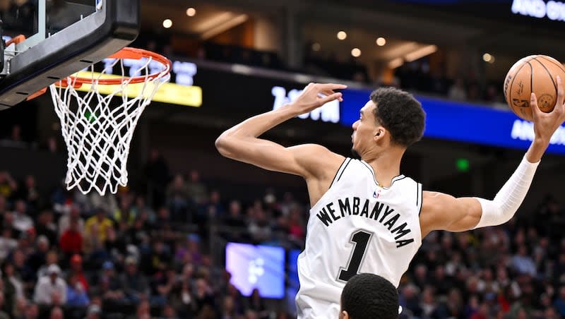 San Antonio Spurs center Victor Wembanyama (1) goes up for a dunk as the Utah Jazz and the San Antonio Spurs play at the Delta Center in Salt Lake City on Wednesday, March 27, 2024.