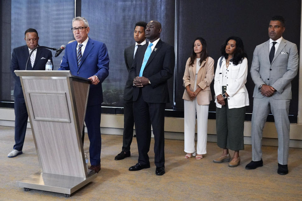 Attorney Steven Levin, second from left, speaks at a news conference in Chicago, Monday, July 24, 2023. The hazing scandal at Northwestern has widened to include a volleyball player who on Monday became the first female athlete to sue the university over allegations she was retaliated against for reporting mistreatment and a new lawsuit by former Northwestern quarterback Lloyd Yates. (AP Photo/Nam Y. Huh)