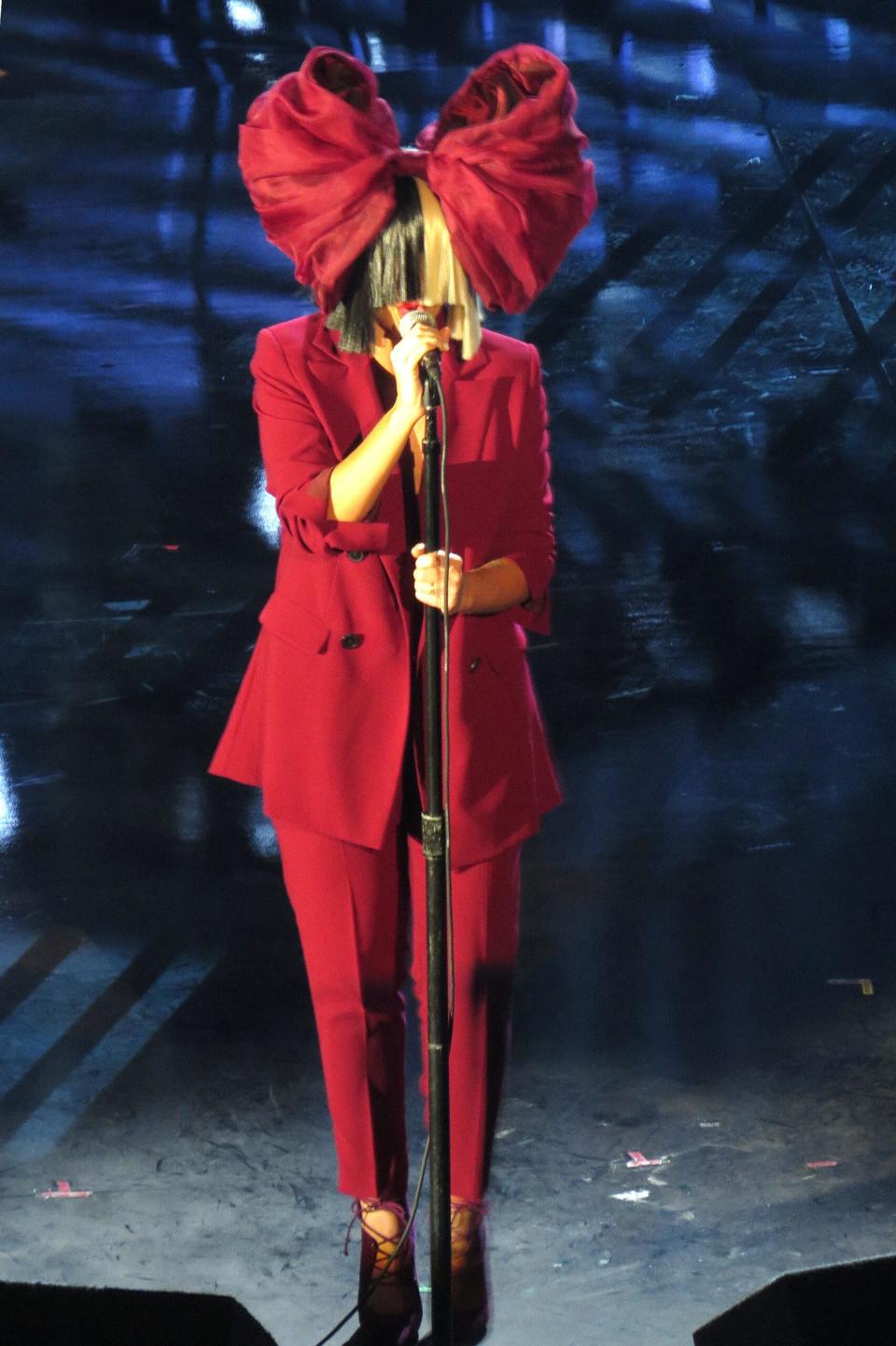Sia performs on stage.