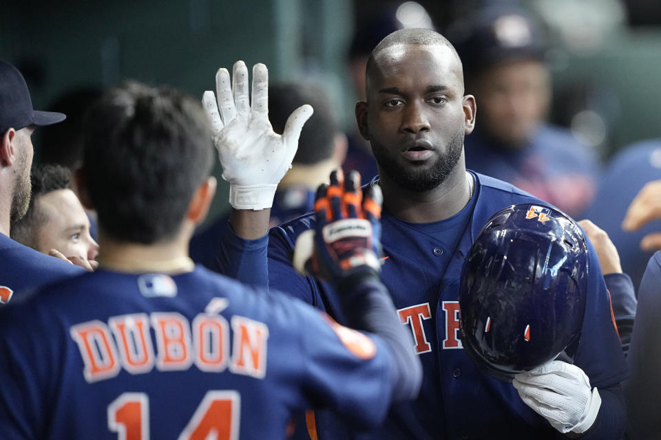 Houston Astros' Yordan Alvarez celebrates in the dugout after hitting a home run against the Kansas City Royals during the fifth inning of a baseball game Sunday, Sept. 24, 2023, in Houston. (AP Photo/David J. Phillip)