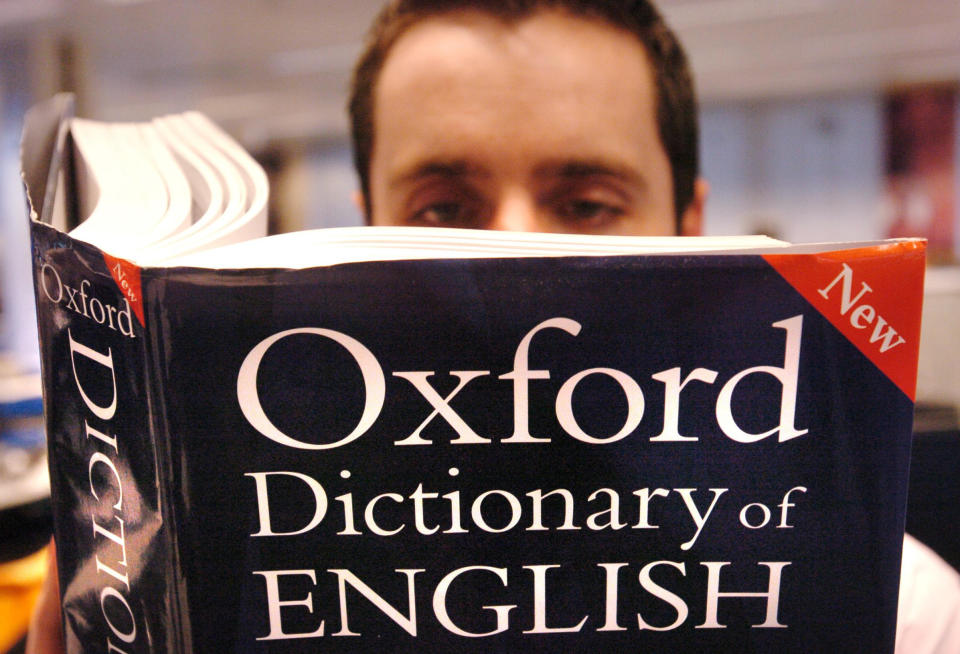 Embargoed to 0001 Thursday March 15  PICTURE POSED BY MODEL. A man reads a copy of the Oxford Dictionary of English.  