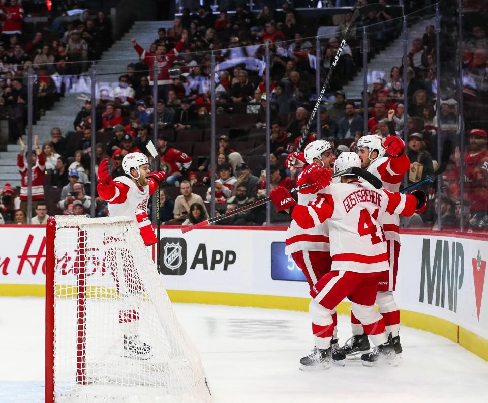 Red Wings defenseman Shayne Gostisbehere celebrates his power play goal against the Senators with (from left) Dylan Larkin, David Perron and Alex DeBrincat in the first period on Saturday, Oct. 21, 2023, in Ottawa.