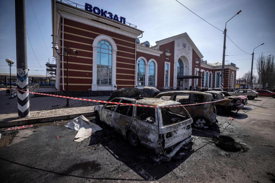 Calcinated cars are pictured outside a train station in Kramatorsk, eastern Ukraine, that was being used for civilian evacuations, after it was hit by a missile attack killing at least 58 people on 8 April last year (AFP/Getty)