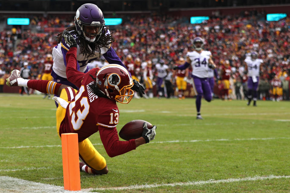 <p>Wide receiver Maurice Harris #13 of the Washington Redskins catches a touchdown pass in front of cornerback Trae Waynes #26 of the Minnesota Vikings during the first quarter at FedExField on November 12, 2017 in Landover, Maryland. (Photo by Patrick Smith/Getty Images) </p>