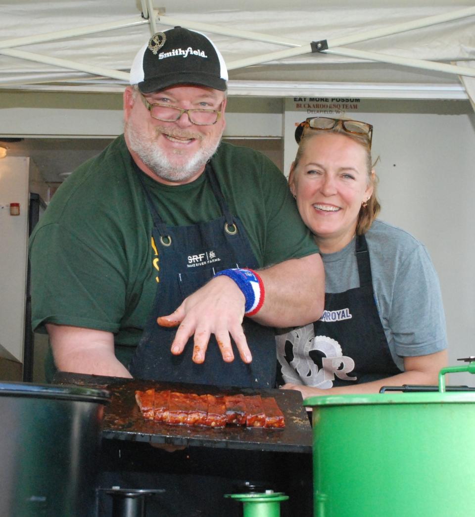 Tom and Becky McIntosh of the T-Mac Smokin barbecue team from Sturgeon Bay show off their pork ribs at the 2021 Death's Door Bar-B-Q contest on Washington Island. T-Mac is a three-time Grand Champion of the Death's Door competition, a Kansas City Barbecue Society-sanctioned event taking place for the 11th time Aug. 25 and 26.