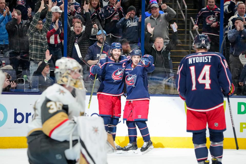 Nov 28, 2022; Columbus, Ohio, USA;  Columbus Blue Jackets left wing Gustav Nyquist (14) and left wing Johnny Gaudreau (13) celebrate a goal by center Boone Jenner (38) past Vegas Golden Knights goaltender Logan Thompson (36) during the third period of the NHL hockey game at Nationwide Arena. Vegas won 3-2 in a shootout. Mandatory Credit: Adam Cairns-The Columbus Dispatch