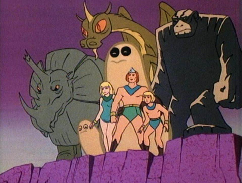 The Herculoids stand on the edge of a cliff, looking at evildoers.