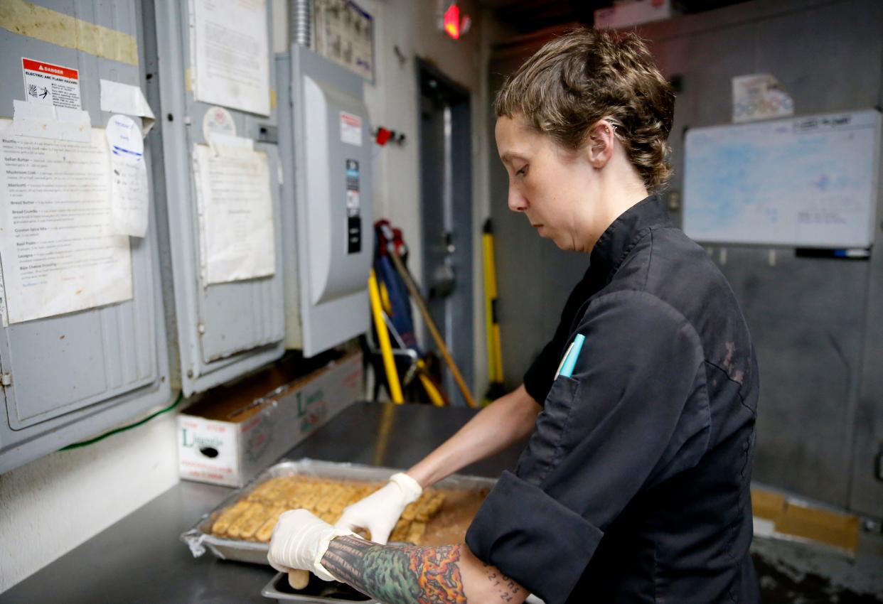 Chef Rachel Foster makes tiramisu Thursday at Moni's Pasta and Pizza. Foster returned to her restaurant May 10, six months and one day after an accident that nearly claimed her life.