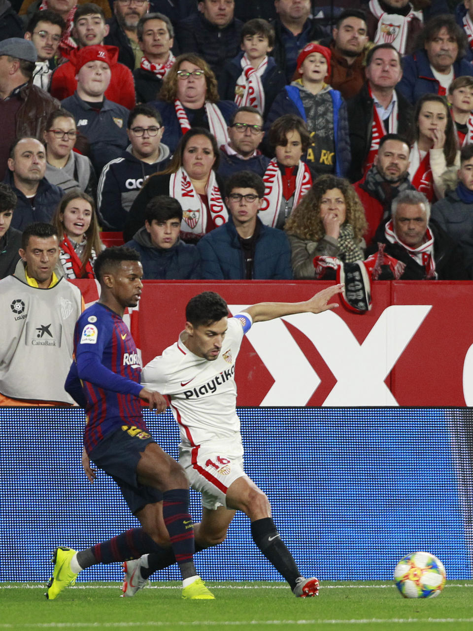 Sevilla's Jesus Navas, right, fight for the ball with FC Barcelona's Nelson Semedo, during a Spanish Copa del Rey soccer match between Sevilla and FC Barcelona at the Ramon Sanche Pizjuan stadium in Seville, Spain, Wednesday Jan. 23, 2019. (AP Photo/Miguel Morenatti)