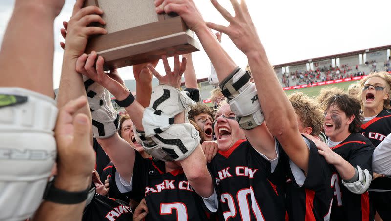 Park City celebrates winning the 5A boys state championship lacrosse game against Olympus at Zions Bank Stadium in Herriman on Friday, May 27, 2022. Park City won 10-9.