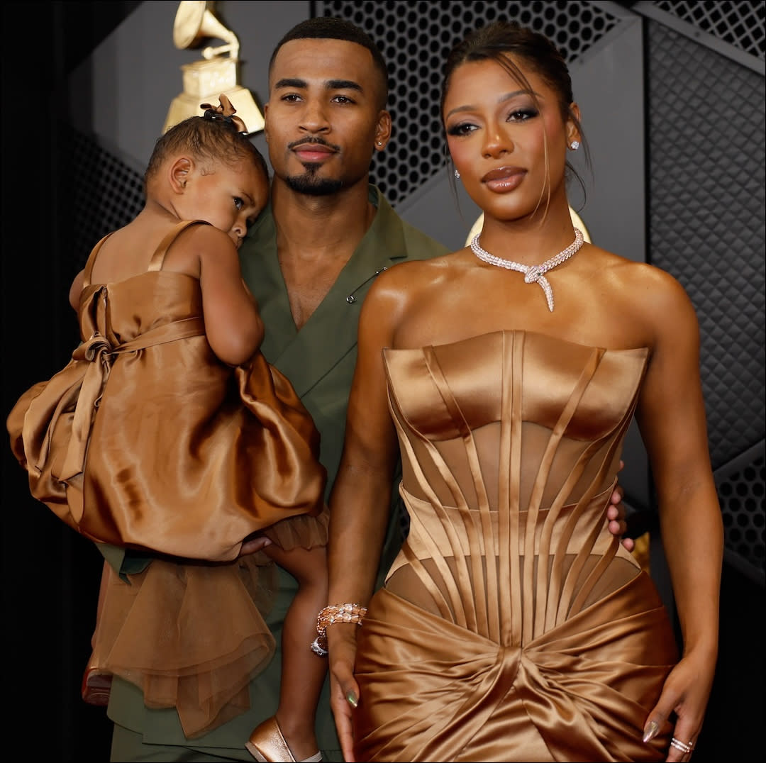 John Gaines, Victoria Monét and Hazel Monét arrives on the Red Carpet at the 66th Grammy Awards. 