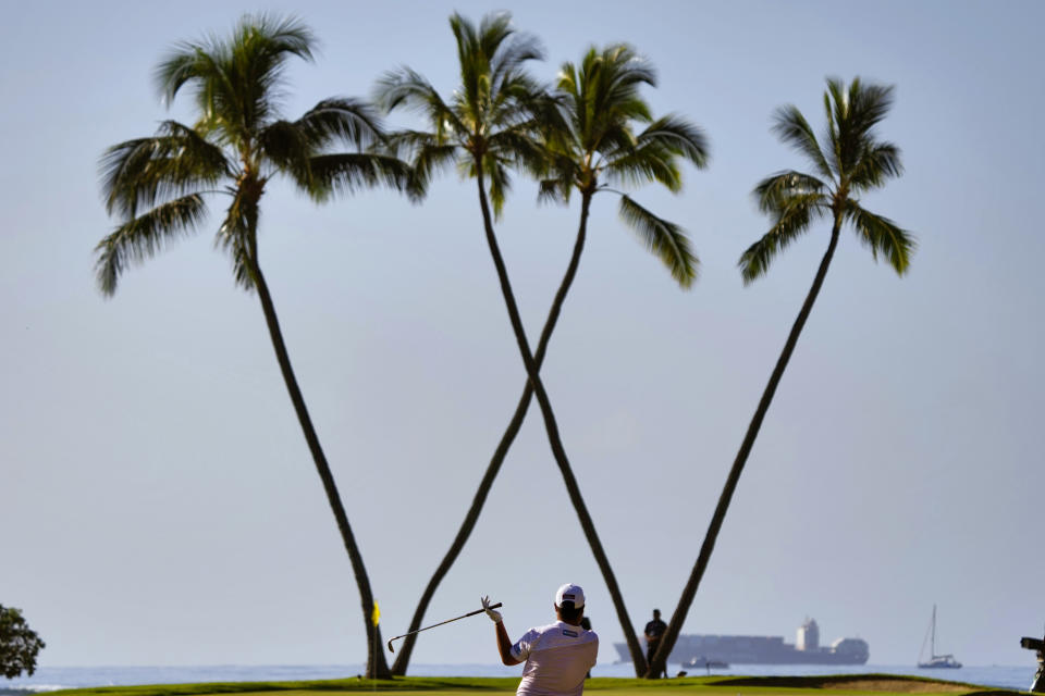 Sungjae Im, of South Korea hits his approach form the 16th fairway during the second round of the Sony Open golf tournament, Friday, Jan. 13, 2023, at Waialae Country Club in Honolulu. (AP Photo/Matt York)