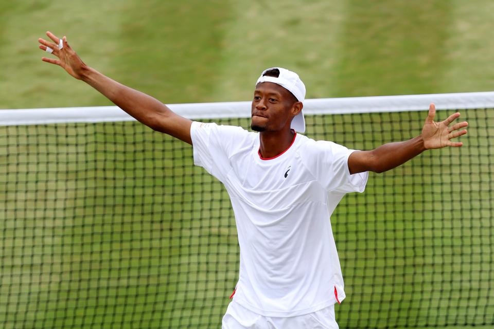 Christopher Eubanks of the United States celebrates victory against Stefanos Tsitsipas of Greece in the fourth round of Wimbledon on July 10, 2023, in London. (Photo by Clive Brunskill/Getty Images) 