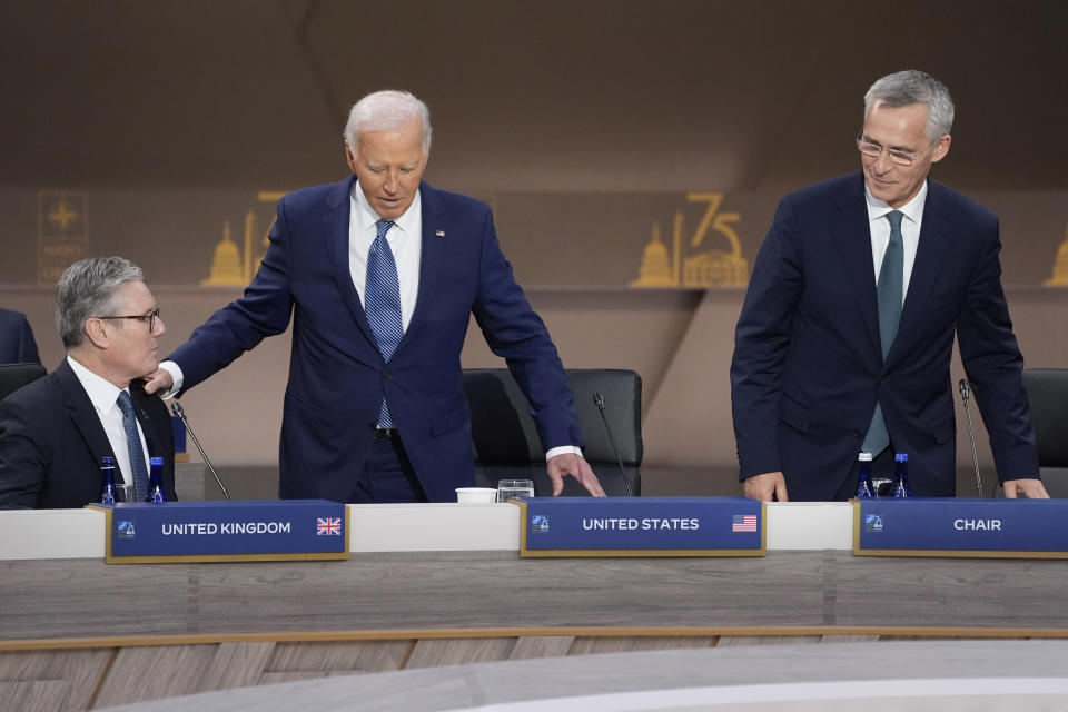 President Joe Biden arrives with NATO Secretary General Jens Stoltenberg as British Prime Minister Keir Starmer watches before the opening session of the NATO Summit, Wednesday, July 10, 2024, in Washington. (AP Photo/Evan Vucci)