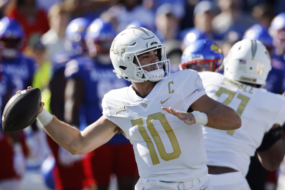 Central Florida quarterback John Rhys Plumlee looks to pass the ball during the first half of an NCAA college football game against Kansas, Saturday, Oct. 7, 2023, in Lawrence, Kan. (AP Photo/Colin E. Braley)