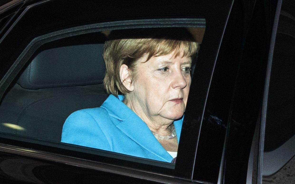 German Chancellor and leader of the Christian Democratic Union (CDU) Angela Merkel leaves after a party leadership meeting at the CDU headquarters in Berlin - AFP