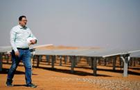 Mohamed Ossama, Project Director for solar energy at Taqa Arabia walks after an interview with Reuters near photovoltaic panels at the Benban plant in Aswan