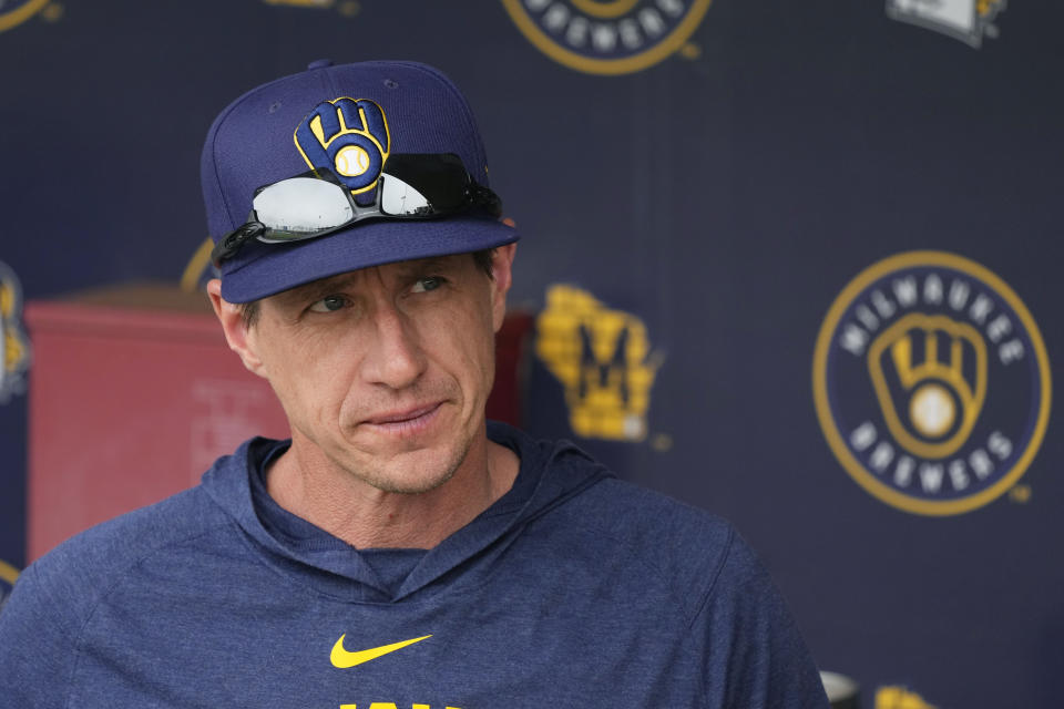 Milwaukee Brewers manager Craig Counsell pauses in the dugout prior to the team's spring training baseball game against the Cincinnati Reds on Sunday, March 19, 2023, in Phoenix. (AP Photo/Ross D. Franklin)