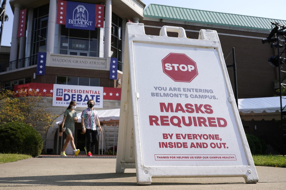 A sign greets visitors outside the Curb Event Center at Belmont University as preparations take place for the second Presidential debate, Tuesday, Oct. 20, 2020, in Nashville, Tenn., during the coronavirus outbreak. Governors of states including Tennessee, Oklahoma, Nebraska and North Dakota are all facing calls from doctors and public health officials to require masks. (AP Photo/Patrick Semansky)