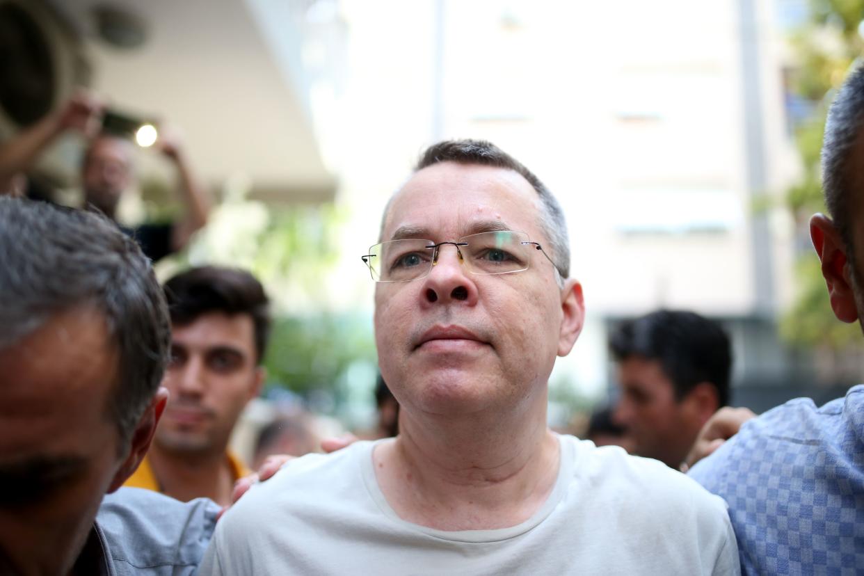 Pastor Andrew Brunson is escorted by Turkish plainclothes police officers on July 25 in Izmir. (Photo: Stringer/AFP/Getty Images)