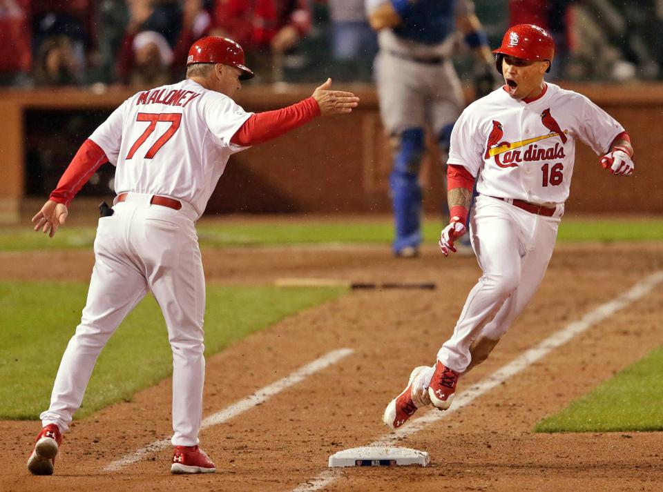 St. Louis Cardinals&#39; Kolten Wong (16) celebrates with first base coach Chris Maloney after Wong&#39;s two-run home run in the seventh inning during Game 3 of baseball&#39;s NL Division Series against the Los Angeles Dodgers, Monday, Oct. 6, 2014, in St. Louis. The Cardinals won 3-1. (AP Photo/St. Louis Post-Dispatch, Huy Mach) EDWARDSVILLE INTELLIGENCER OUT; THE ALTON TELEGRAPH OUT