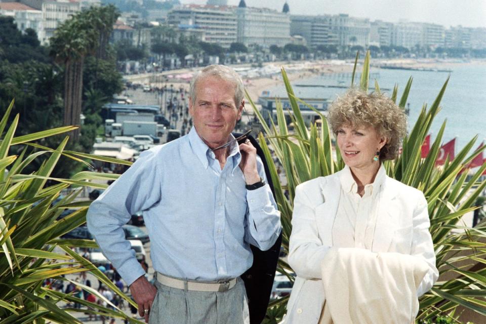 Paul Newman poses on May 12, 1987 with his wife, actress Joanne Woodward during the Cannes International Film Festival (AFP via Getty Images)
