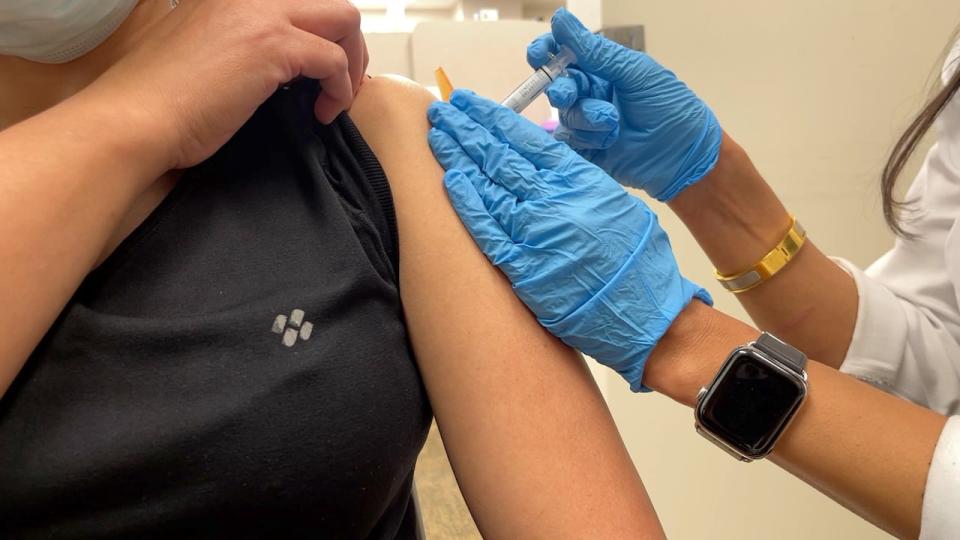 Pharmacist Shivali Sharma giving a flu shot