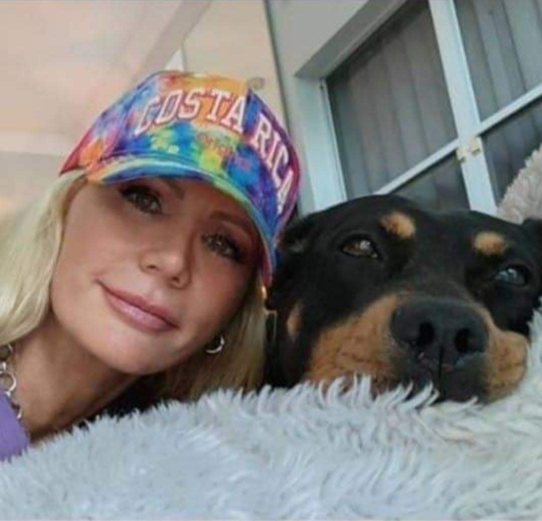 Kim Goddard, daughter of the late meteorologist and animal welfare advocate Dick Goddard, has started an online petition pushing for felony charges against a Portage County homeowner where 146 dead dogs were found. Here the Aurora native is shown with a Petunia, a dog she rescued from a kill shelter in Florida, where Goddard now lives. Goddard's father called her Petunia when she was a child.