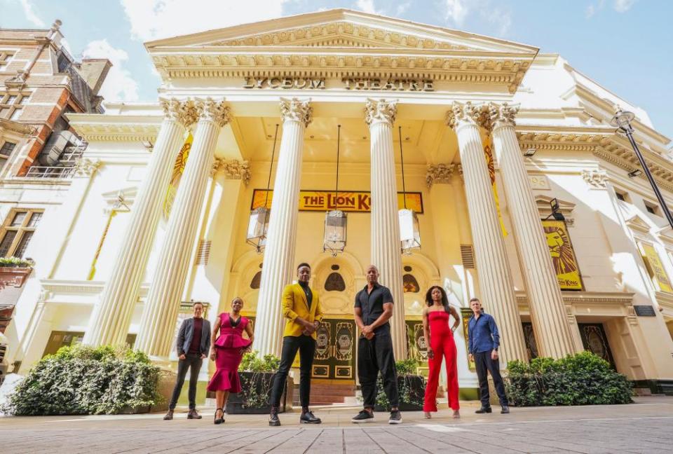 Some of the cast of Disney’s The Lion King in front of the Lyceum theatre in London.