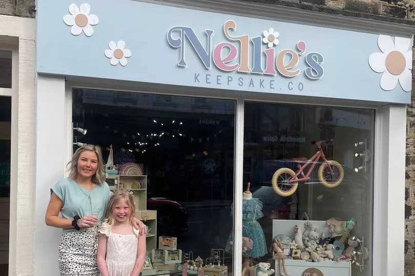 Nichola Radcliffe with her daughter Nellie outside the family-owned business in the centre of Holmfirth -Credit:Nellie's Keepsake Co.